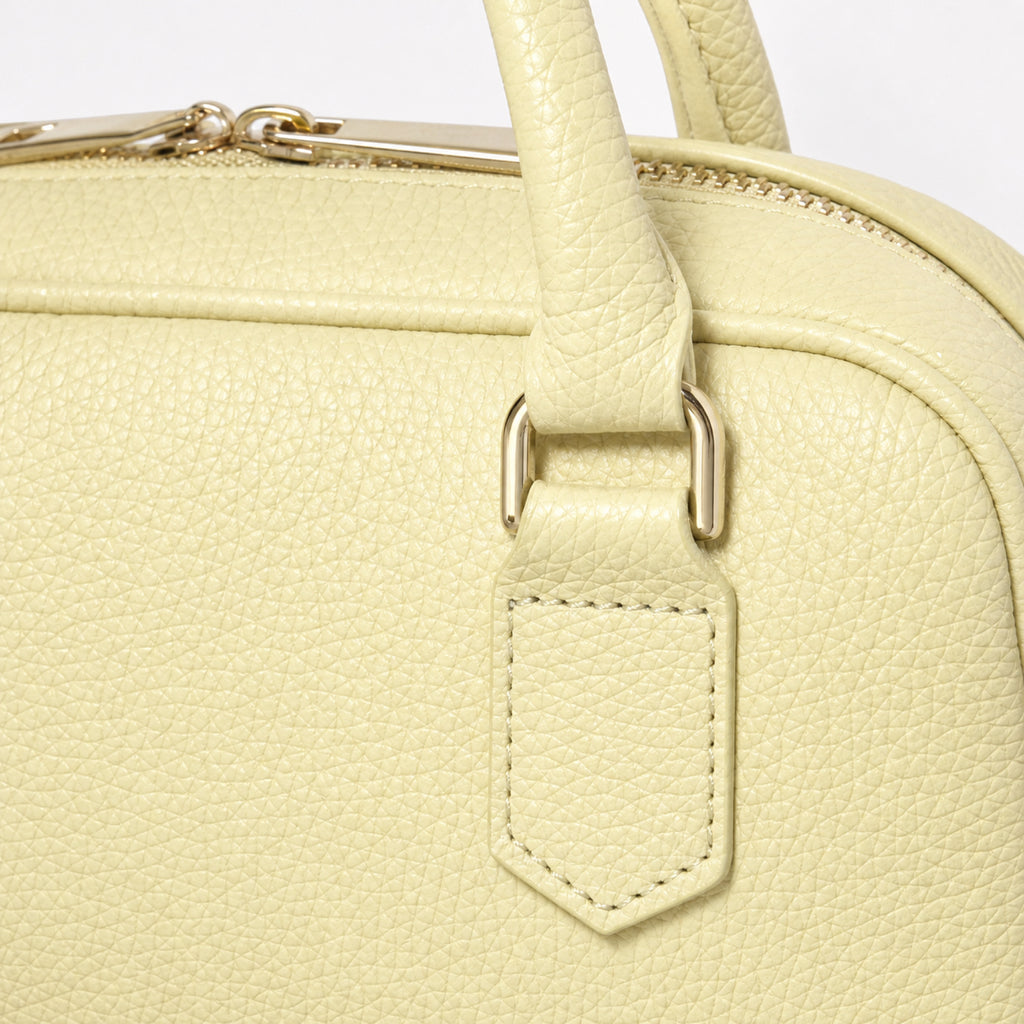 Jasny złoty torebka skórzana mini bostonka z paskiem crossbody, detal materiału