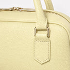 Jasny złoty torebka skórzana mini bostonka z paskiem crossbody, detal materiału